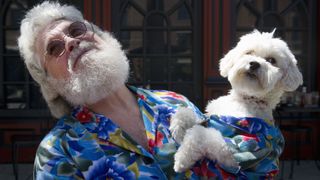 Senior man with lookalike dog