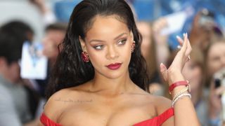 Pop singer and Fenty entrepreneur Rihanna wears a red dress to a red car film premiere in London's Leicester Square