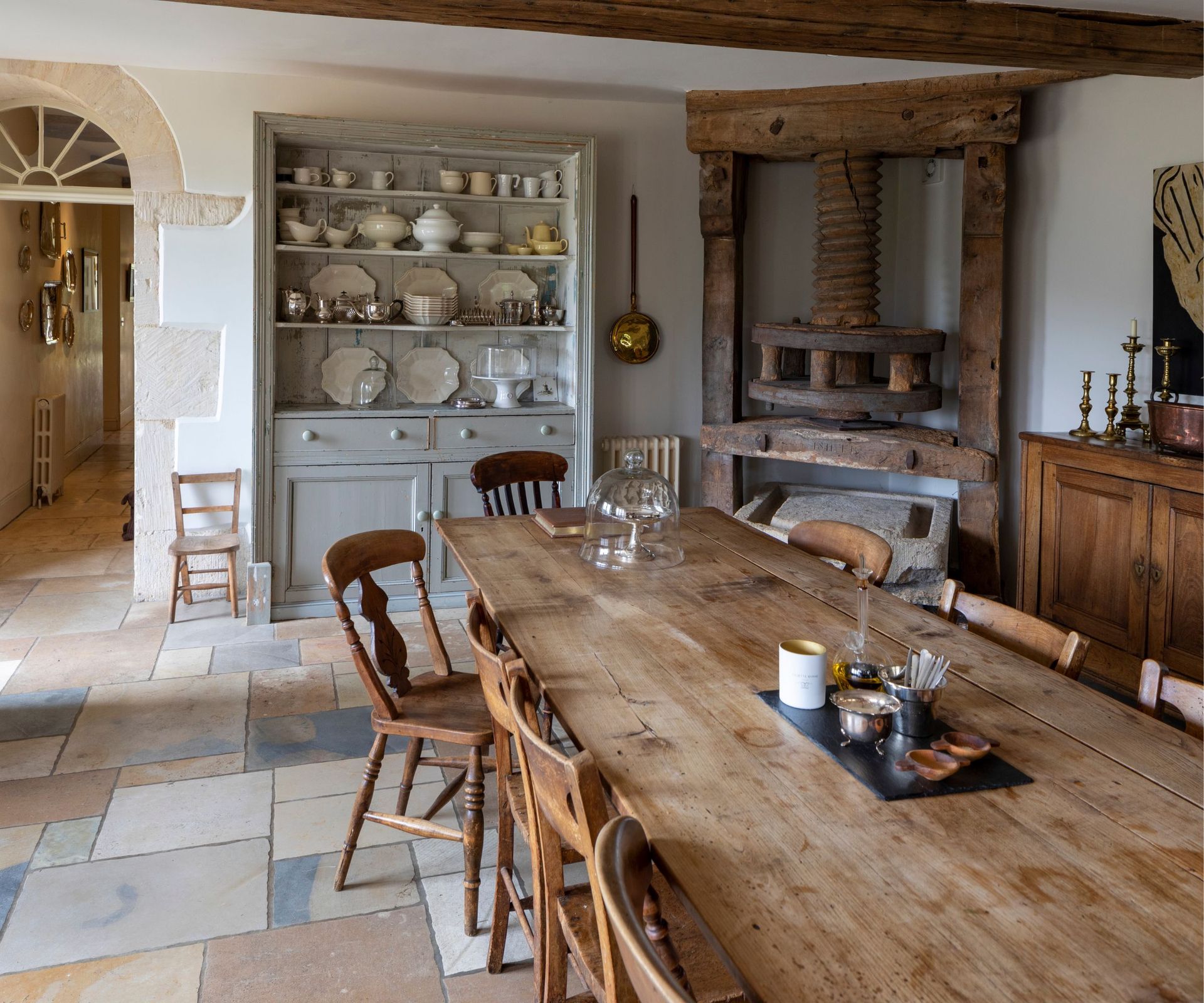 Wooden dining table, stone floor, wooden cabinet