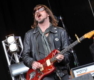 Rival Sons' Scott Holiday plays a Fender Jazzmaster onstage at High Voltage Festival on July 23, 2011 in London.