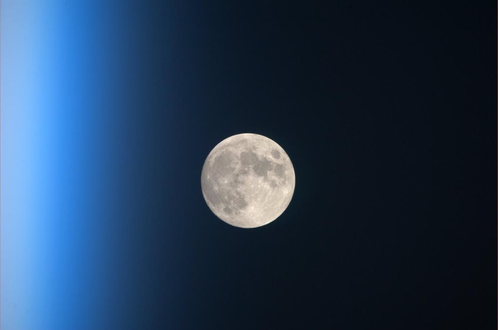 The full moon rises over Earth in this view from space taken Nov. 17, 2013 by Japanese astronaut Koichi Wakata on the International Space Station.