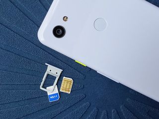 Visible SIM card next to Pixel 3a