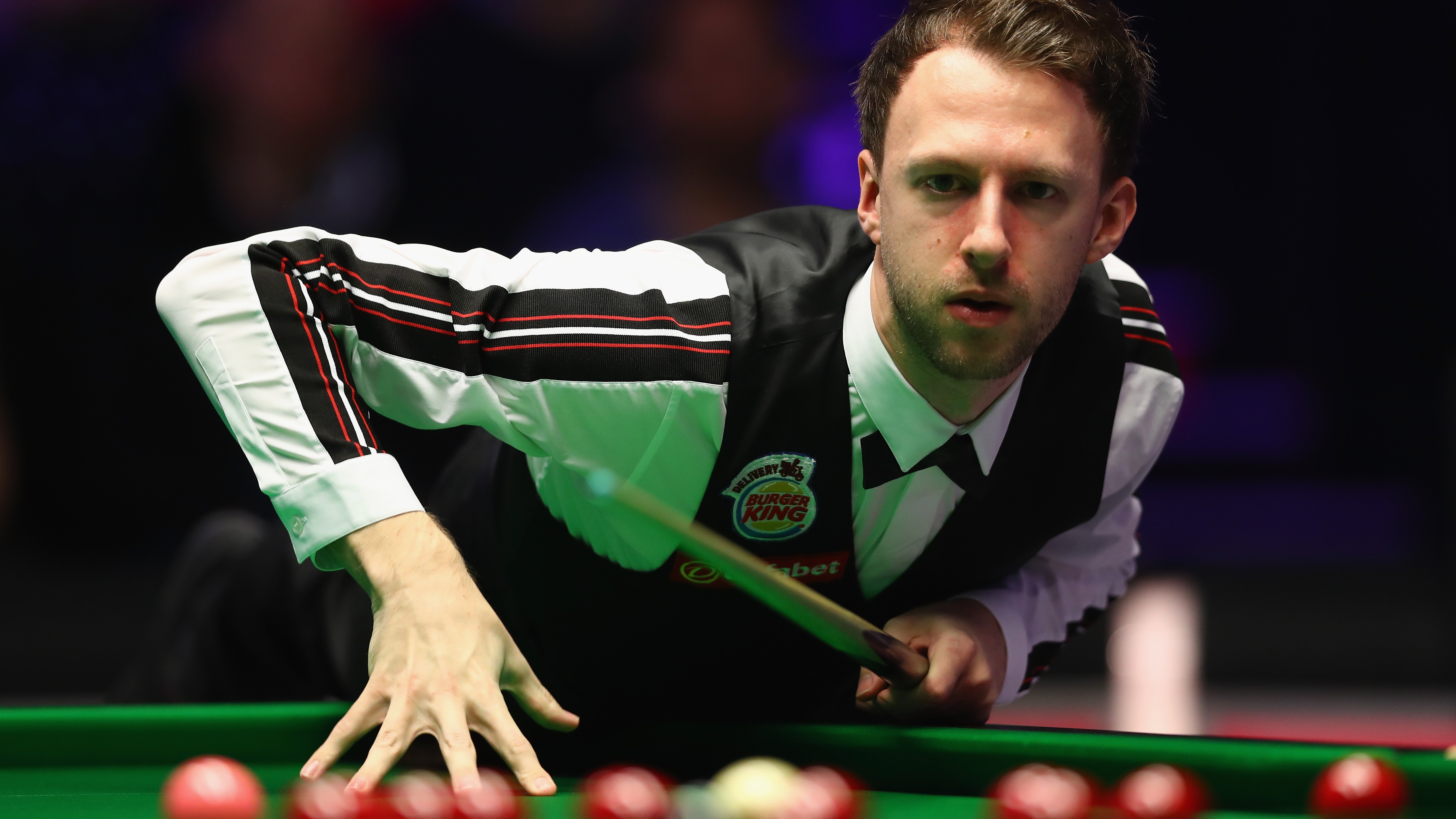 LONDON, ENGLAND - JANUARY 15: Judd Trump of England prepares to play a shot during his match against Liang Wenbo of China on day two of The Dafabet Masters at Alexandra Palace on January 15, 2018 in London, England. (Photo by Naomi Baker/Getty Images)