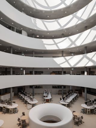 Herzog& de Meuron Children's Hospital in Zurich timber building interior and exterior engulfed in foliage