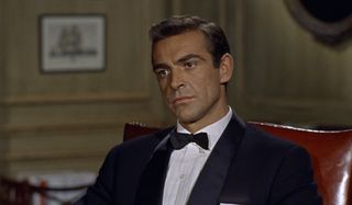 Dr. No Sean Connery sitting in M's office, tuxedoed