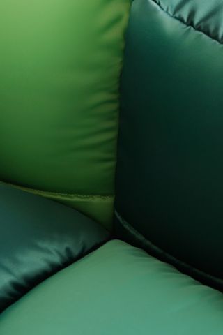 Vetsak x Aspesi Transformation green sofa and bright cushions