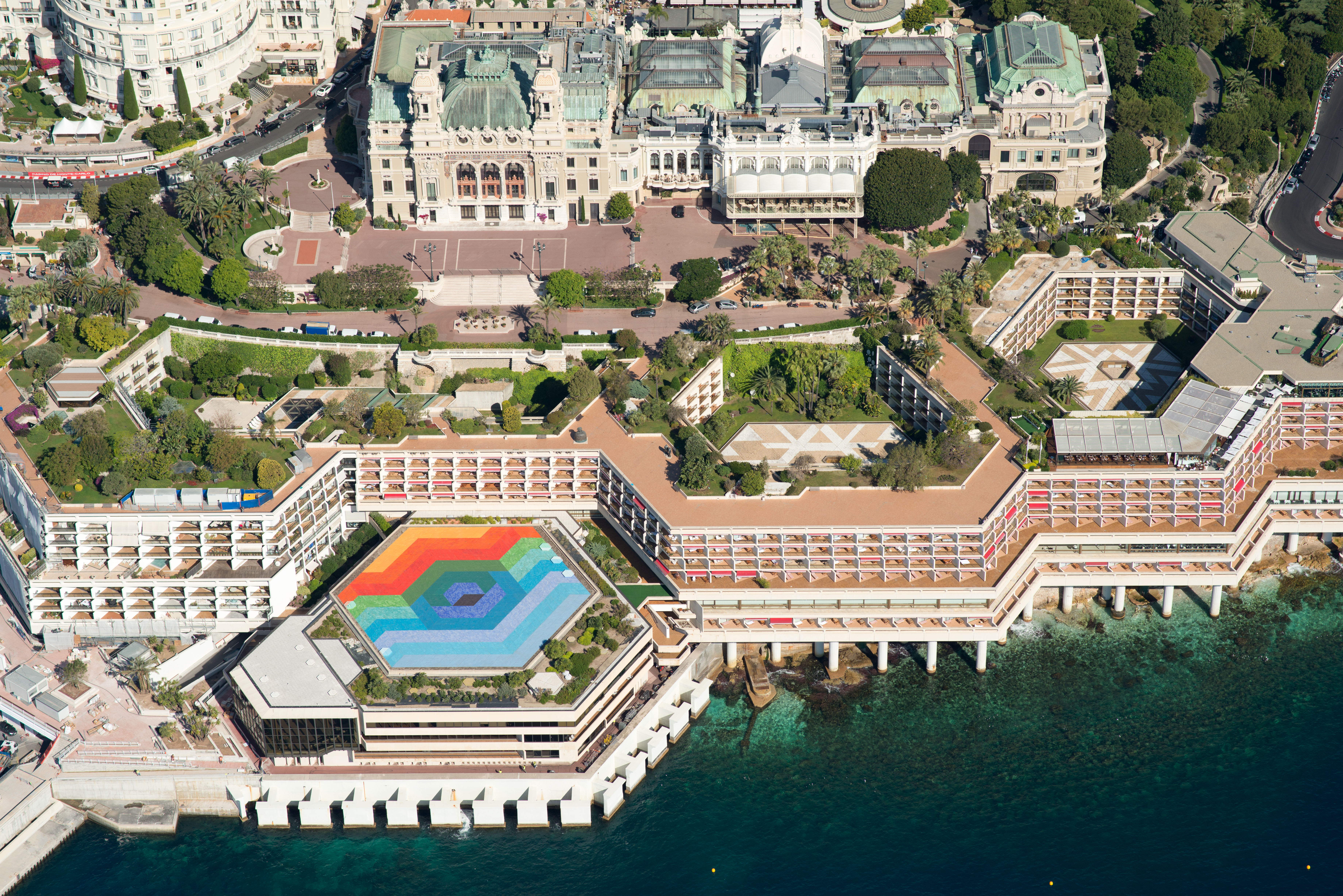 An aerial photograph of a hexagonal-shaped, multi-coloured tiled flat roof