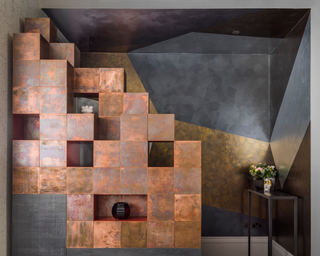 Galvanized copper bespoke cube shelving in modern space with metal accents designed by Shalini Misra