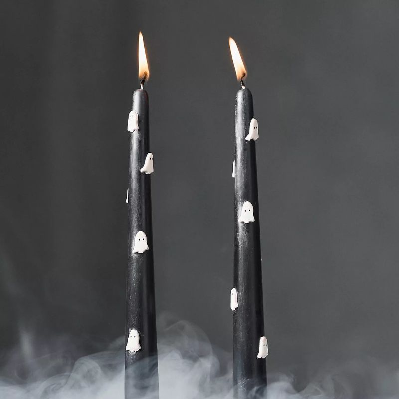 black Halloween taper candles with white ghosts