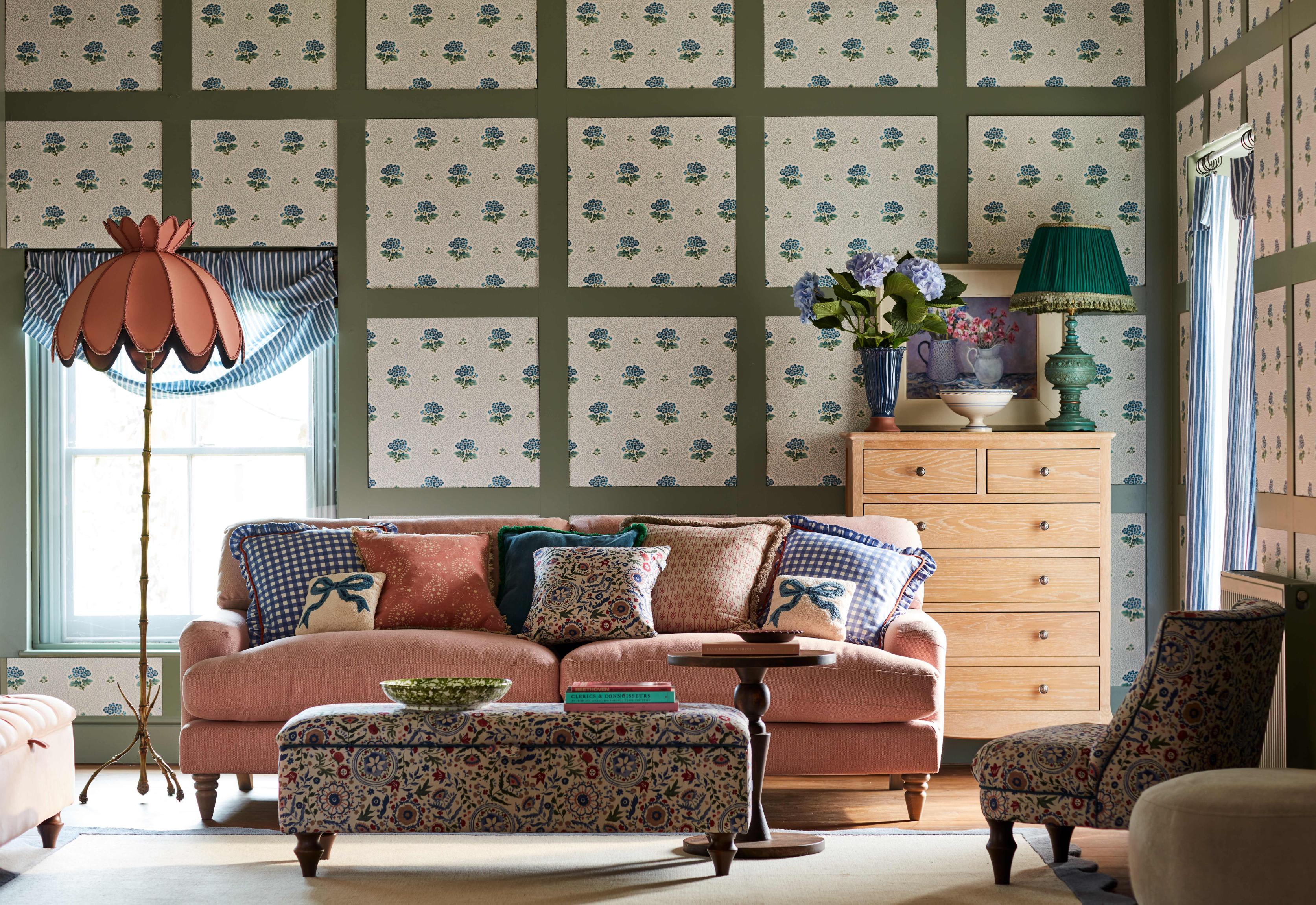 Chintz wallpaper in living space with sofa