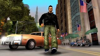 A GTA 3 screenshot showing protagonist Claude walking on the road in front of a car in Liberty City. An American flag can be seen on the side of a building on the right-hand side 