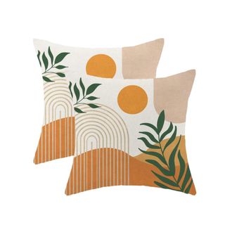 Two pillowcases with sun and plant illustrations on them