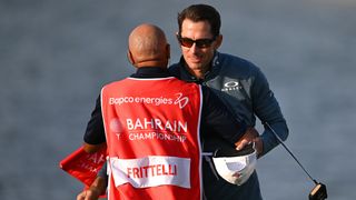 Dylan Frittelli celebrates his Bahrain Championship win with his caddie