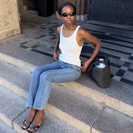 Woman in a tank top and jeans