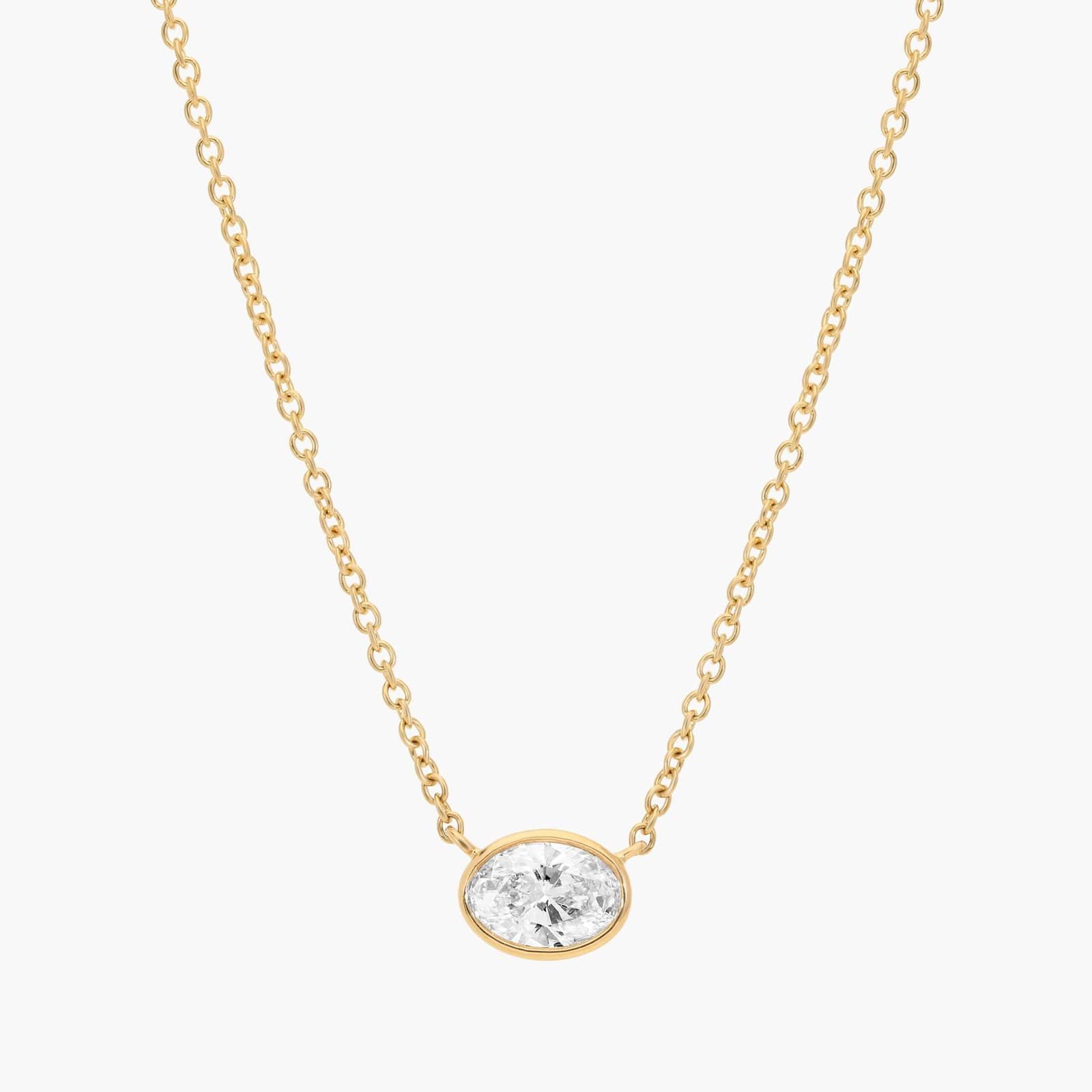 East-West Bezel Solitaire Pendant Necklace With 0.5 Ctw Oval Cut Diamond in 14k Yellow Gold