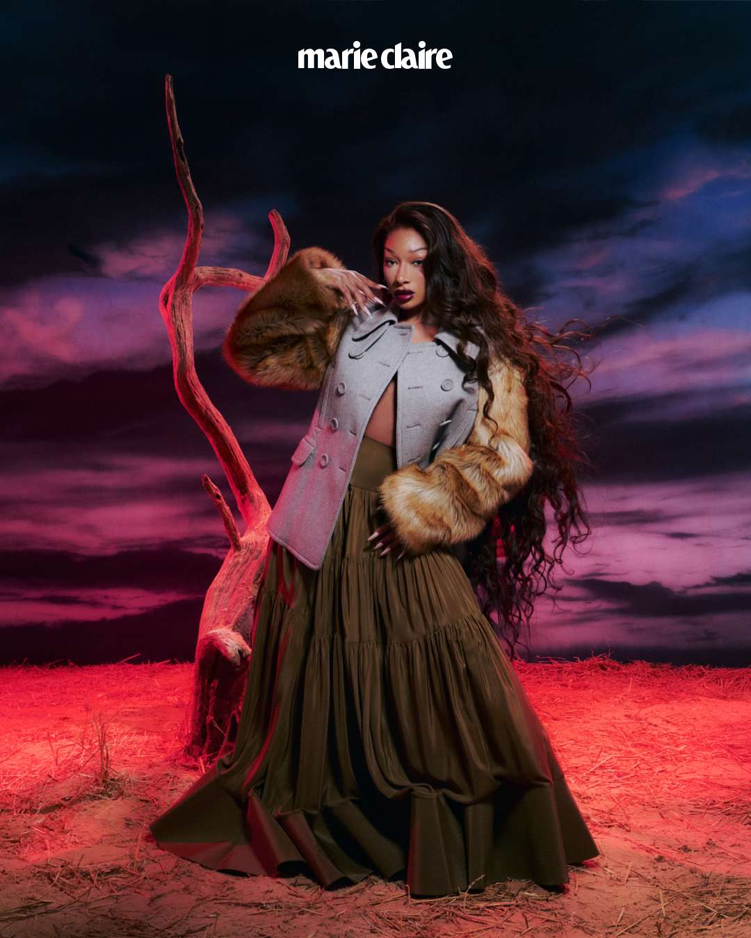 Megan Thee Stallion poses in a long skirt and furry jacket for Marie Claire