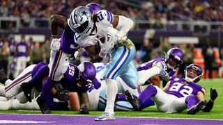 Ezekiel Elliott #21 of the Dallas Cowboys rushes for a touchdown against the Minnesota Vikings during the third quarter at U.S. Bank Stadium on November 20, 2022 in Minneapolis, Minnesota.