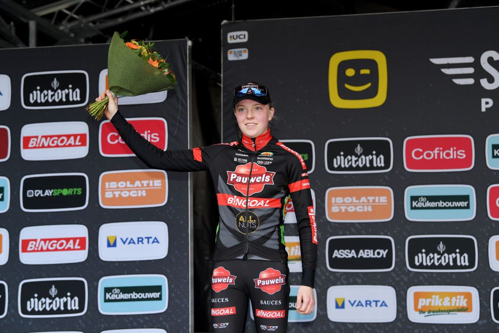 ZOLDER BELGIUM DECEMBER 27 Fem Van Empel of The Netherlands and Team Pauwels Sauzen Bingoal celebrates winning the second place on the podium ceremony after the 17th Superprestige HeusdenZolder 2021 Womens Elite SuperprestigeCX SPHeusdenZolder on December 27 2021 in Zolder Belgium Photo by Luc ClaessenGetty Images