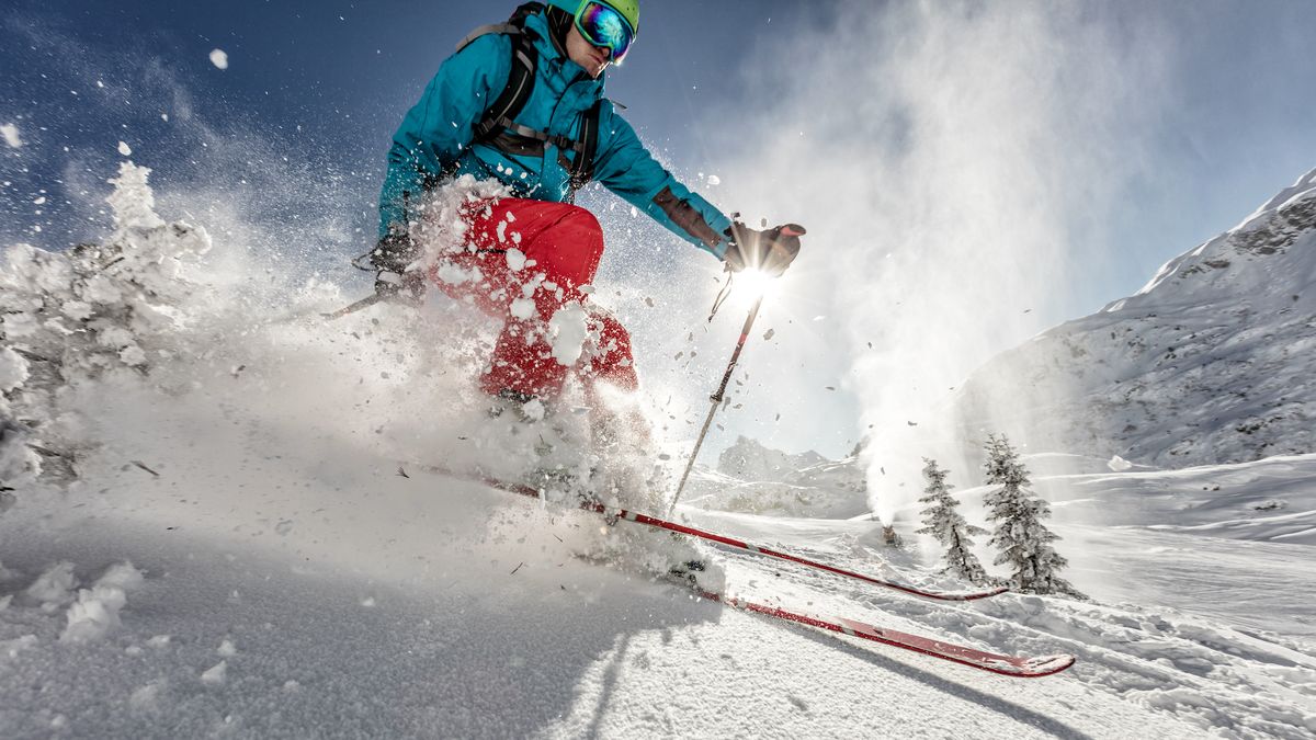 Man freerideer running downhill 