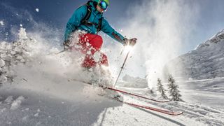 Man freerideer running downhill 