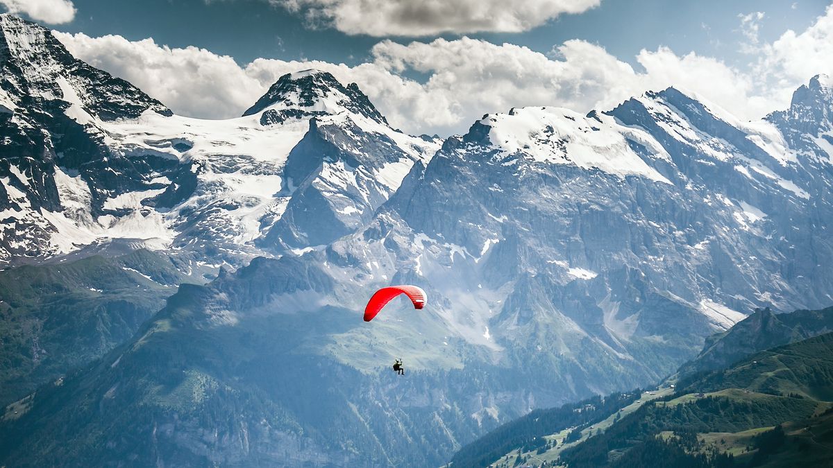 Paragliding over Swiss Alps at Männlichen in Wengen