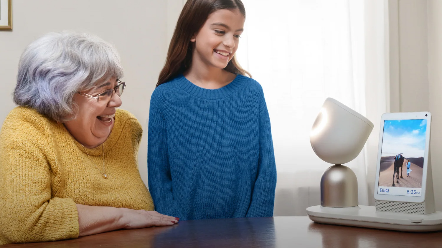 ElliQ robot with an elderly person