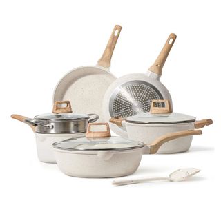 A set of cream granite pots and pans