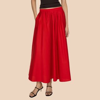 flat lay cropped image of woman wearing red long skirt