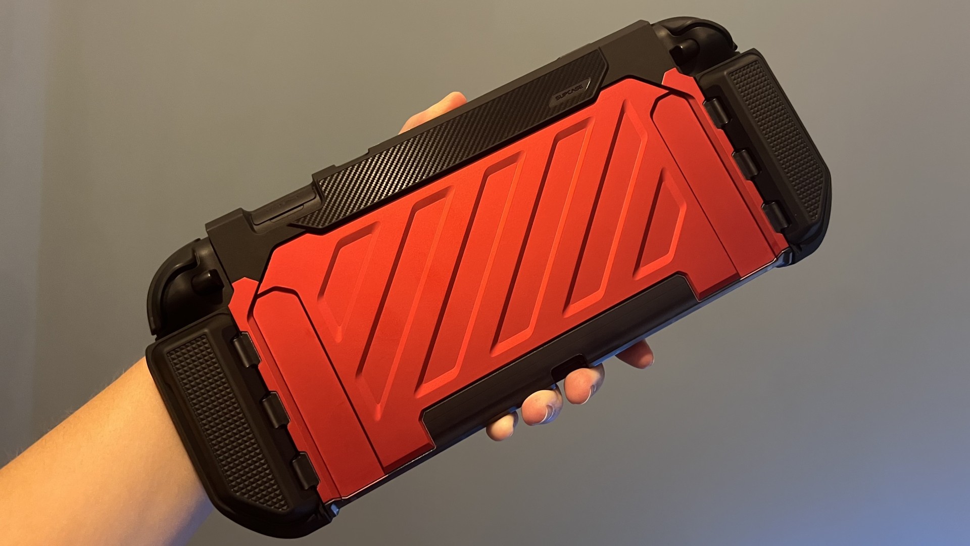 Supcase Unicorn Beetle Pro Nintendo Switch 2 case in red being held up against a blue background