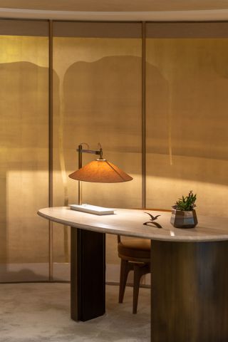 Close up of desk, chair and lamp inside the study at Shui On Land in Hong Kong