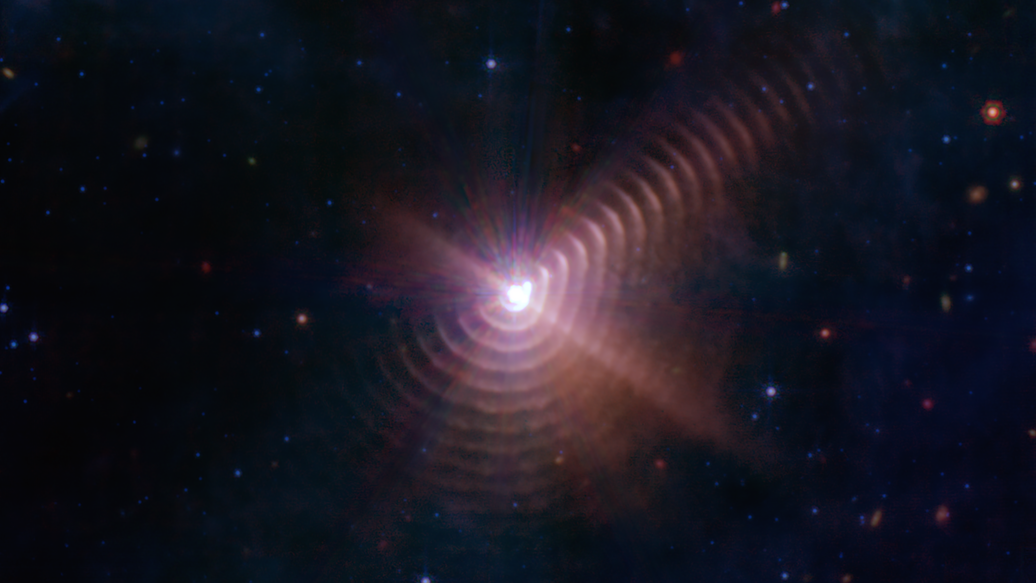 An image of WR140 from the James Webb Space Telescope shows concentric rings around a pair of massive stars.