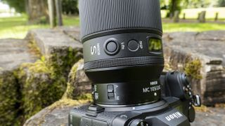 A close up of the buttons and switches on the Nikon Nikkor Z MC 105mm f/2.8 VR S lens