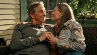 Doc and Hope embrace on their porch bench