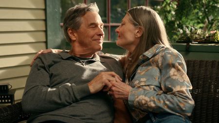 Doc and Hope embrace on their porch bench