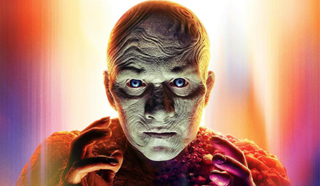 A weird-looking bald superhero with luminous blue eyes