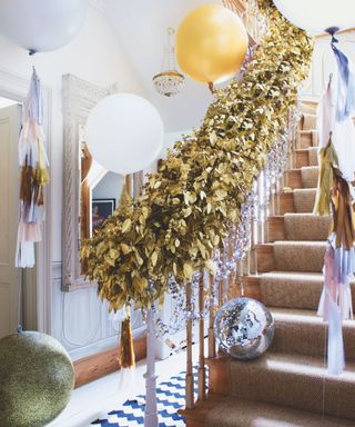 garland, disco ball, balloons in an entryway