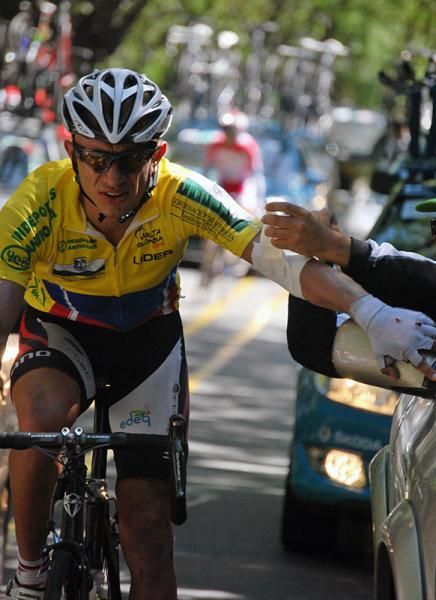 Race leader Marlon Perez is attended to by the race doctor following a crash.