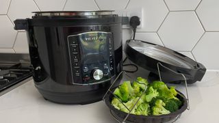 The Instant Pot Pro Crisp next to some broccoli, which was steamed in the multi-cooker