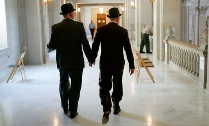 A couple walks through City Hall in San Francisco before their wedding ceremony.