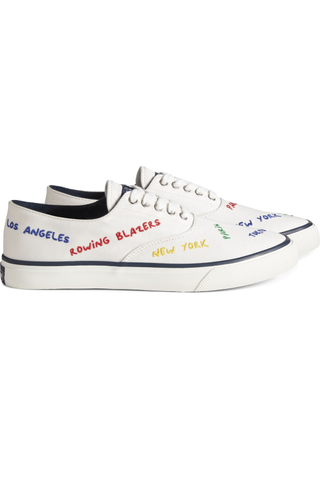 white sneakers with colorful words written on them
