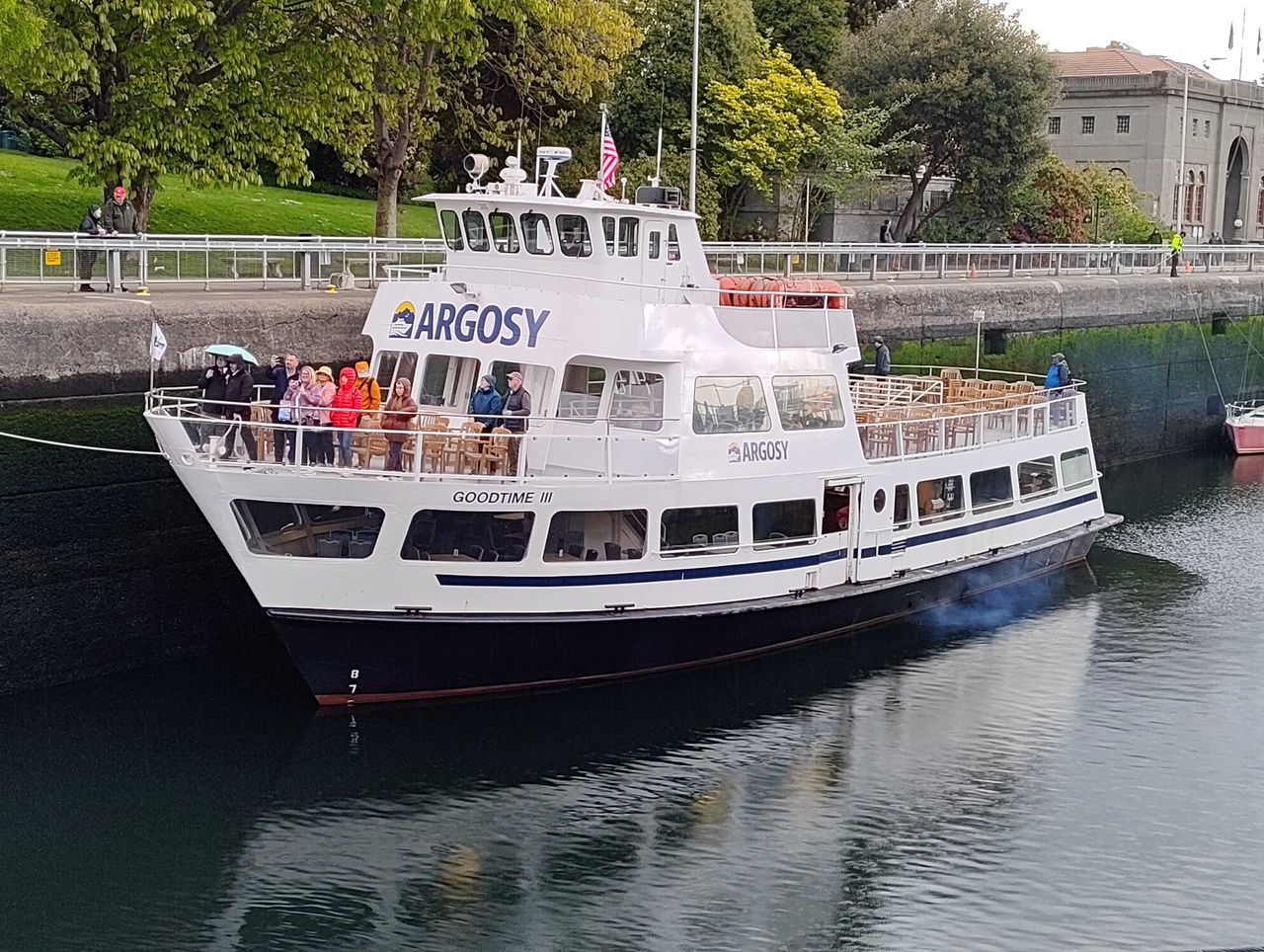 A boat on the water with people on it