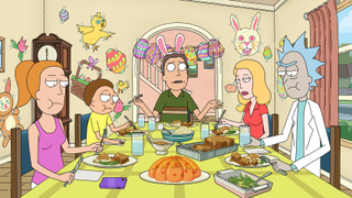 Surrounded by cheerful Easter decorations, the Smith family (from left to right: Summer, Morty, Jerry, Beth, and Rick) sit glumly around the dinner table as Jerry, wearing bunny ears, looks on bemused, in a scene from Rick and Morty Season 8.