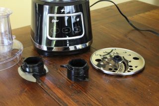 Oster 10-Cup Food Processor alongside its many attachments