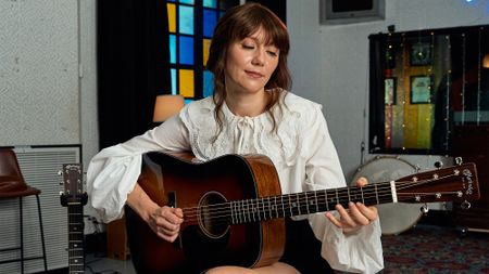 A photo of Molly Tuttle with the Martin D-18 Molly Tuttle