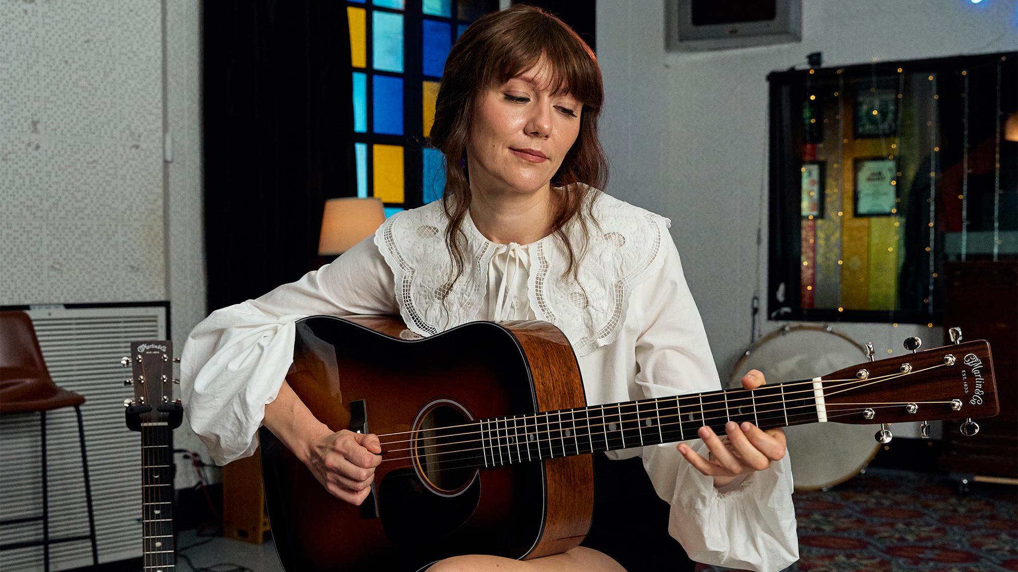 A photo of Molly Tuttle with the Martin D-18 Molly Tuttle