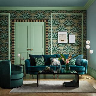 Green patterned living room with a green door, a black coffee table and a green sofa