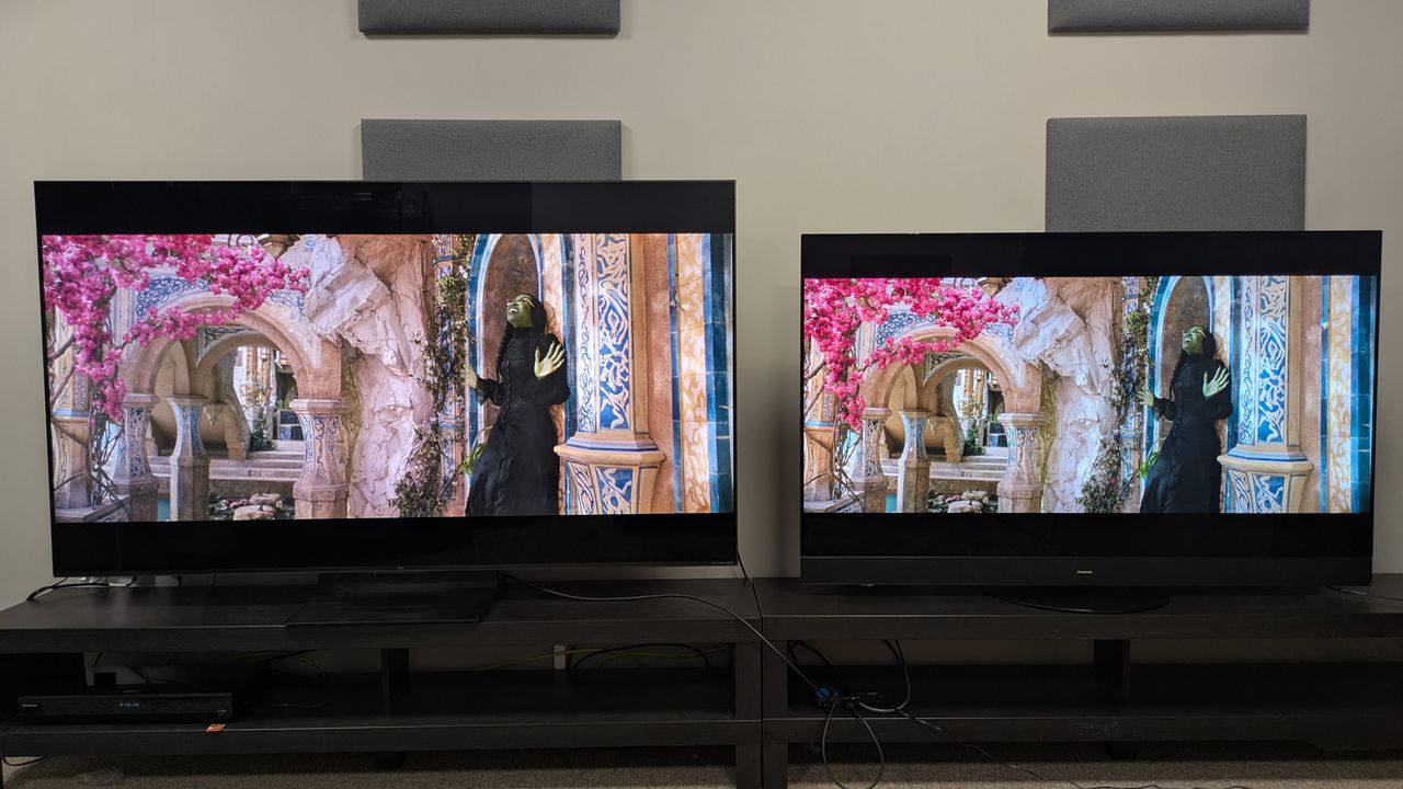 TCL C7K mini-LED left and Panasonic MZ1500 OLED right displaying Elphaba on a ledge from Wicked on screen