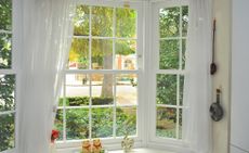 best window cleaning solution: large window looking out onto street
