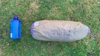 Robens Starlight 1 tent in sack beside 1L Nalgene bottle