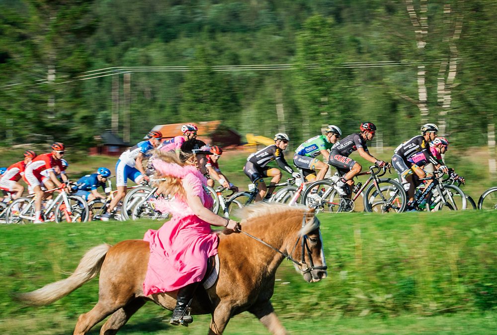 Riding horseback alongside the peloton at the Arctic Race of Norway